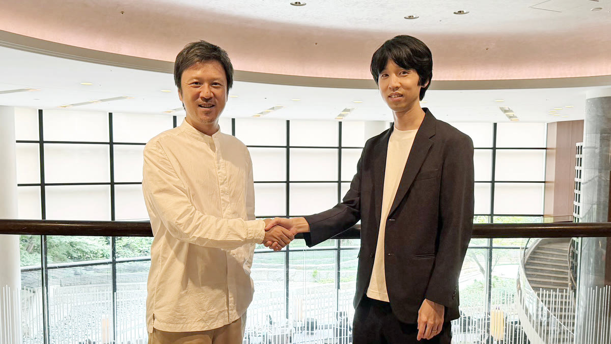 ベイジ代表と握手する川合